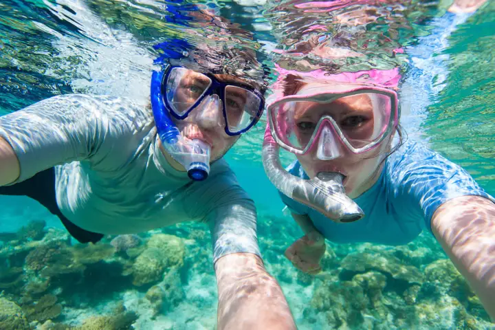 a man swimming in a pool of water